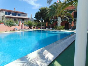 Seasonal outdoor pool, pool umbrellas, sun loungers