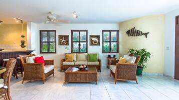 Apartment, Ocean View, Beachfront | Living room | Flat-screen TV