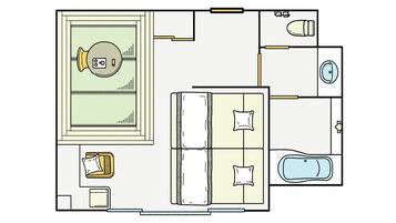 Distribución de una habitación de hotel con cama, escritorio, baño y un pequeño rincón de estar.