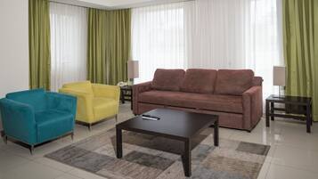 Suite, 1 King Bed | Down comforters, in-room safe, desk, blackout drapes