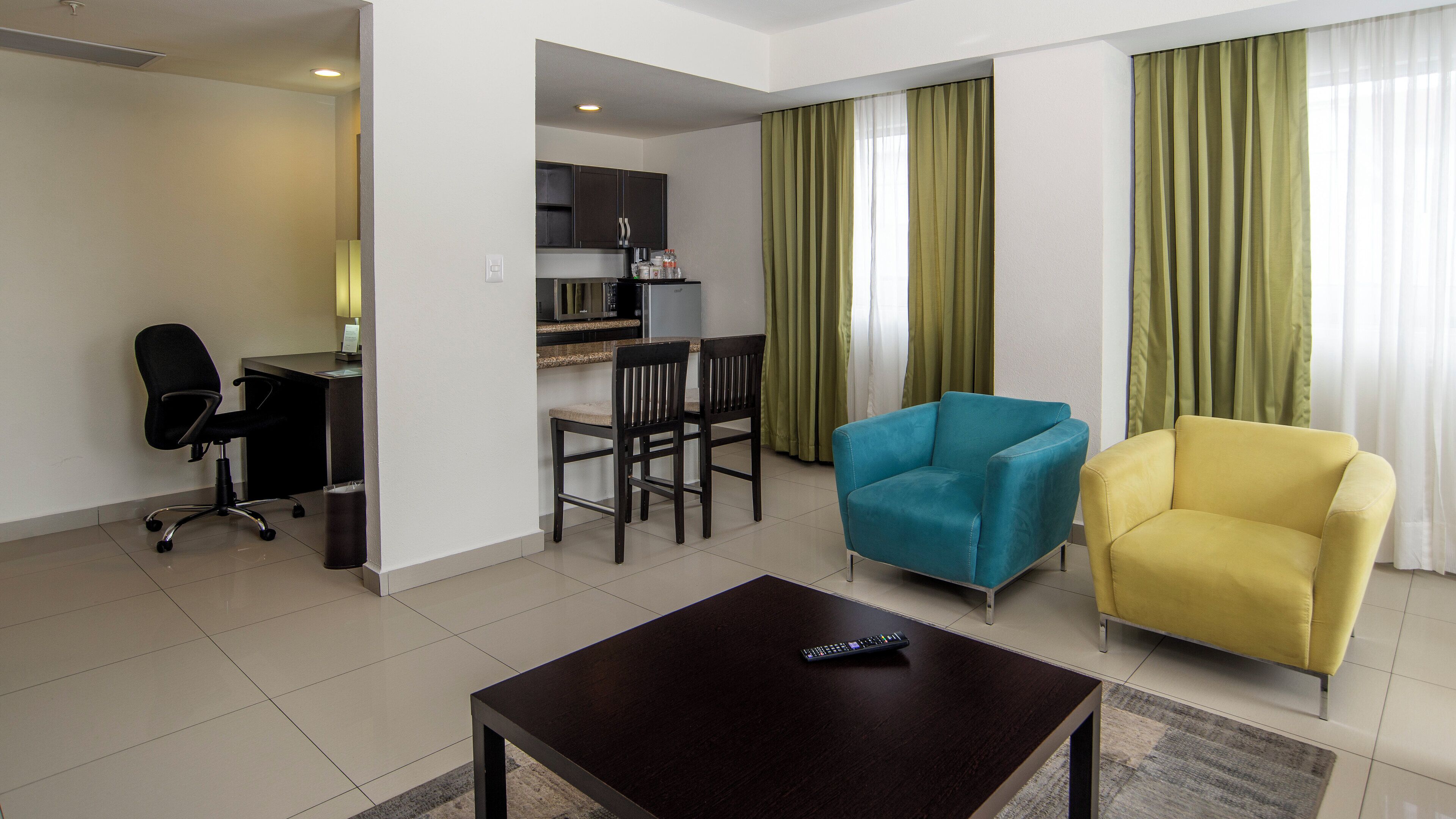 Suite, 1 King Bed | Down comforters, in-room safe, desk, blackout drapes