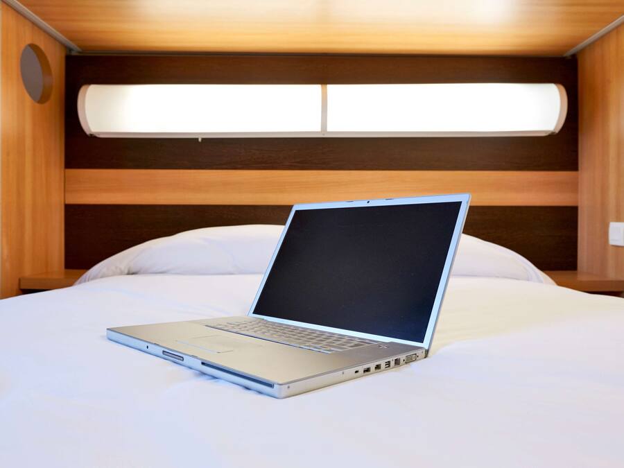 Premium bedding, desk, blackout curtains, soundproofing