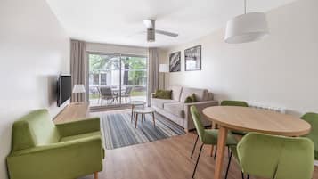 Apartment, 1 Bedroom | Living room | 40-inch flat-screen TV with digital channels, TV