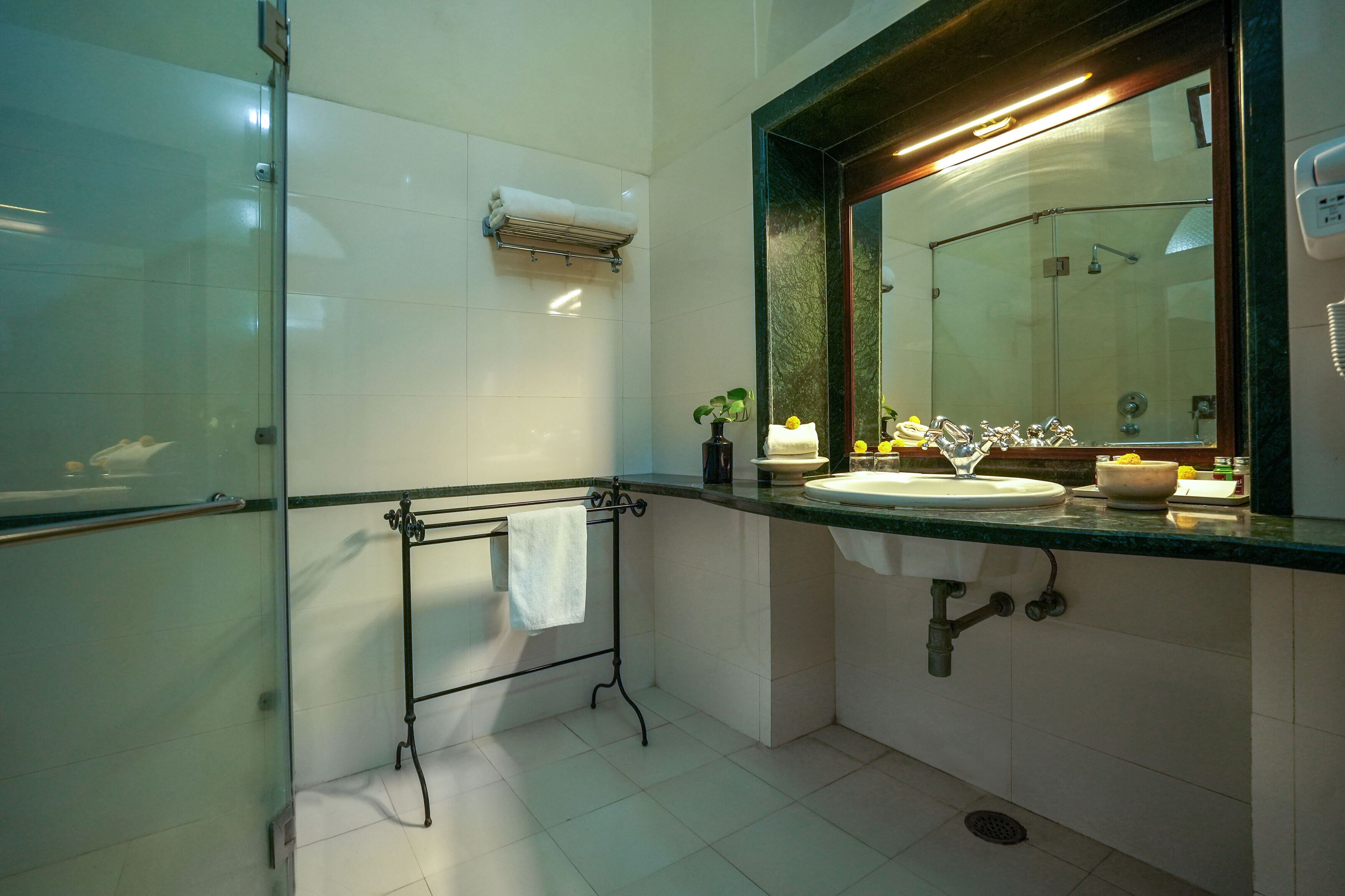 heritage deluxe room | bathroom | shower, rainfall showerhead, free toiletries, hair dryer