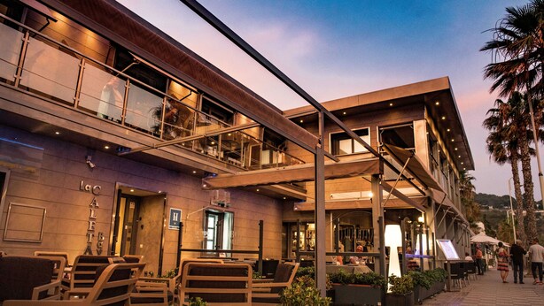 A modern building with outdoor seating, a visible entrance, and a sign reading "Lac Aletay". - H.Boutique la Caleta bay (Almunecar)
