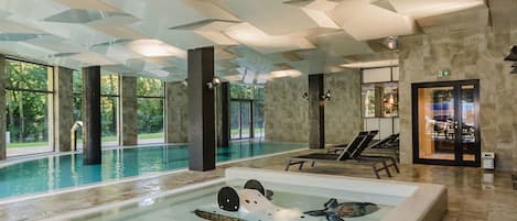 Indoor pool, pool loungers, lifeguards on site