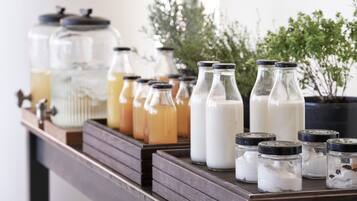 A wooden shelf with glass jars containing various liquids and powders.