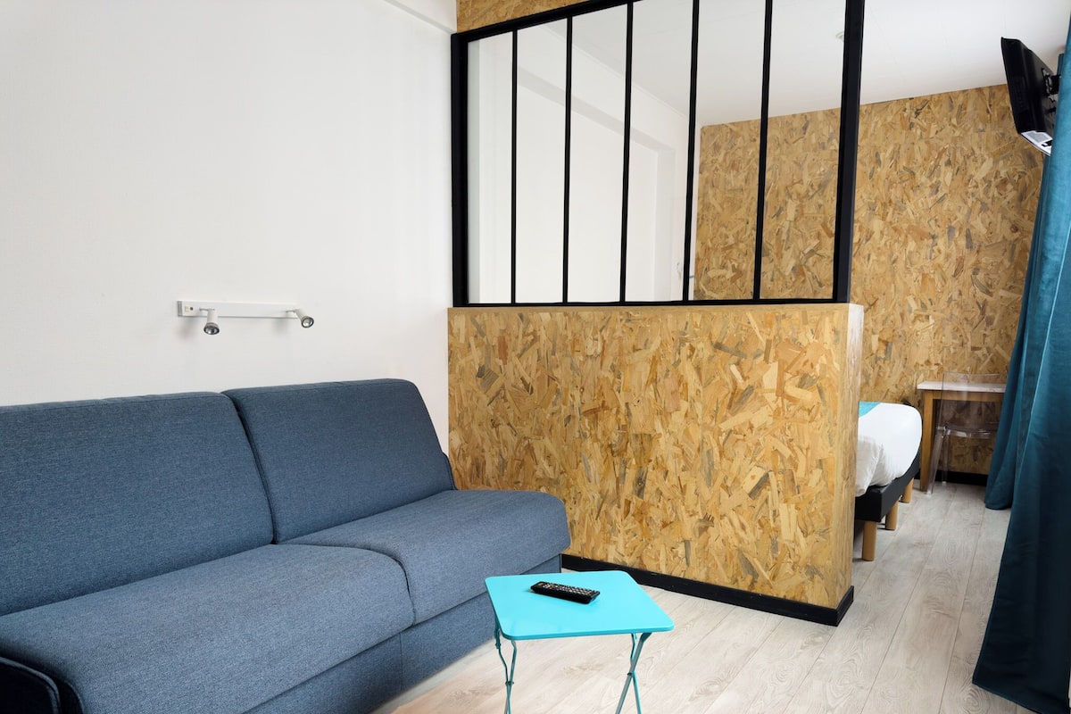 Family Room | Desk, laptop workspace, bed sheets
