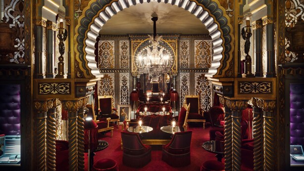 A luxurious interior with ornate arches, a chandelier, and plush seating. - Maison Souquet, Hotel & Spa (Paris)