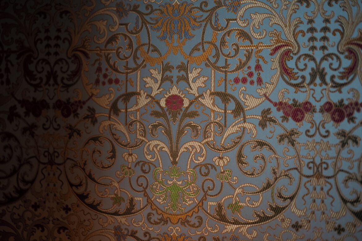 A close-up of a patterned fabric with intricate designs.