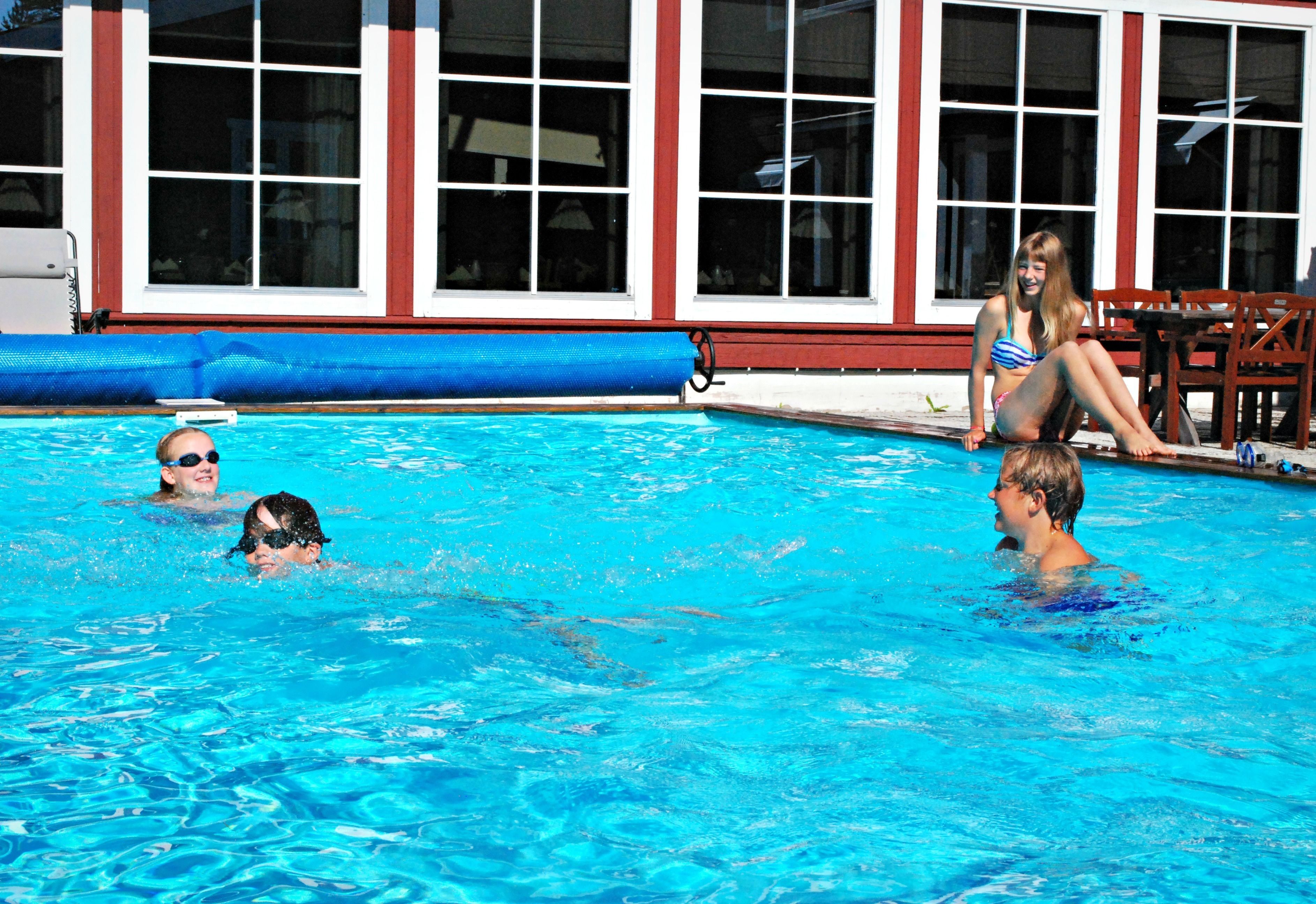 outdoor pool, pool umbrellas, pool loungers