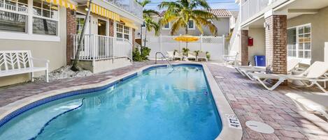 Outdoor pool, open 9:00 AM to 9:00 PM, pool umbrellas, pool loungers