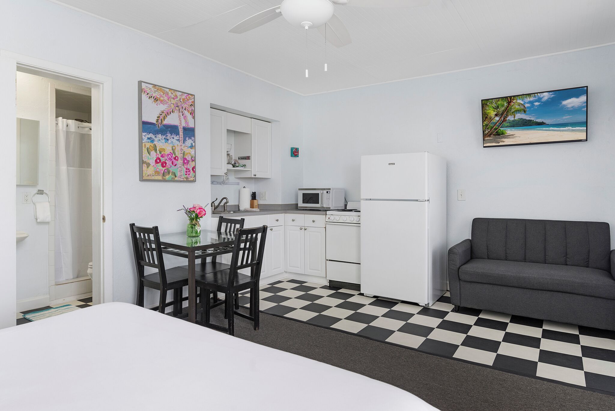 deluxe studio, 1 queen bed with sofa bed, ocean view | living area | 32-inch flat-screen tv with digital channels, tv