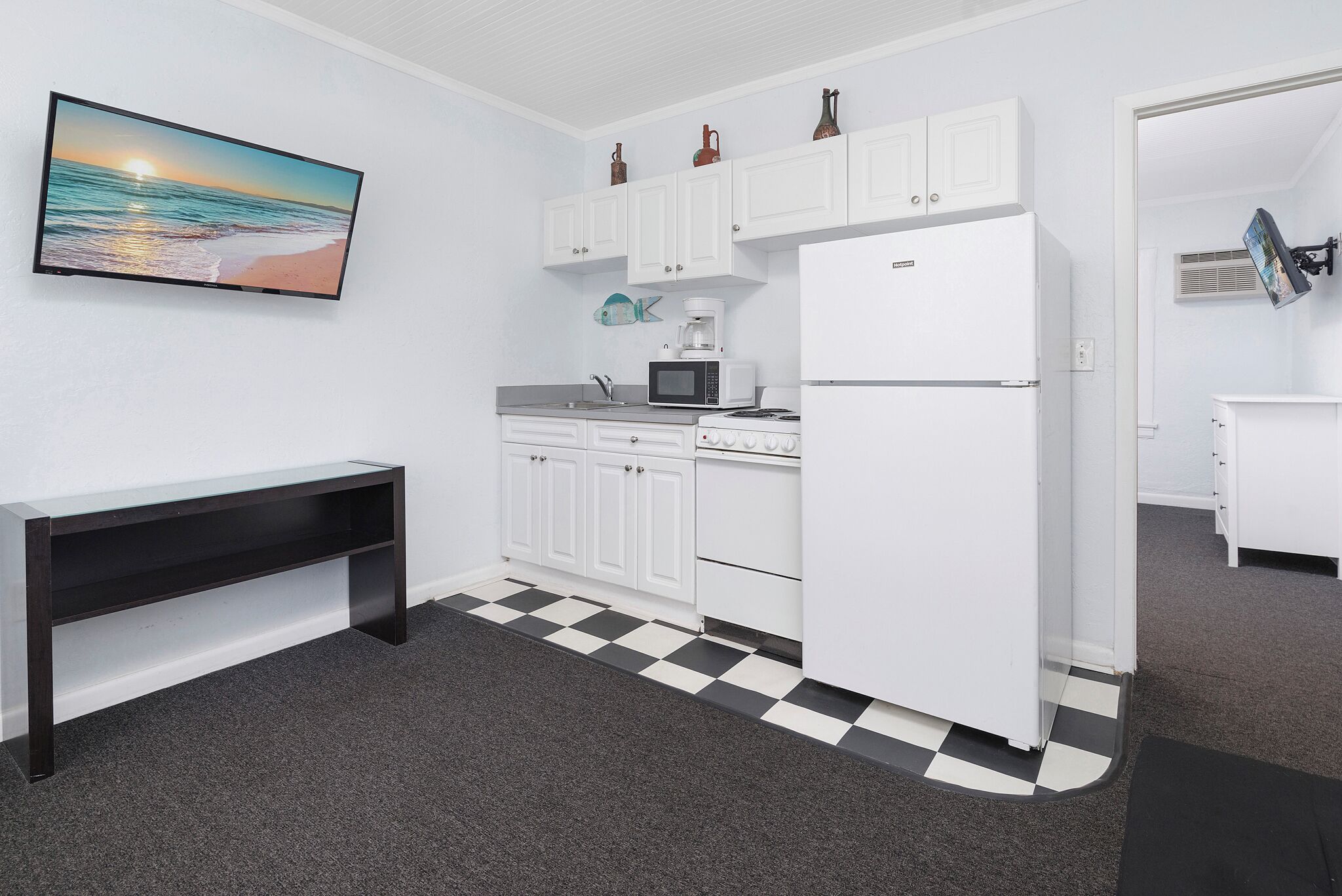 family apartment, 1 bedroom, balcony, pool view | private kitchen | full-sized fridge, microwave, stovetop, coffee/tea maker