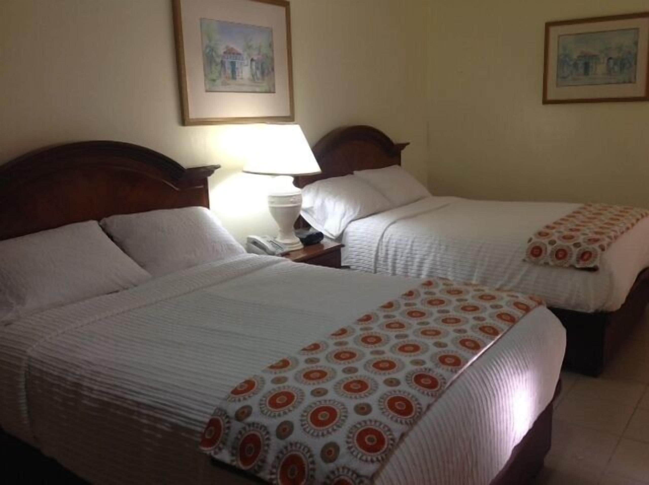 Standard Room, 2 Queen Beds | Pillowtop beds, in-room safe, desk, free WiFi