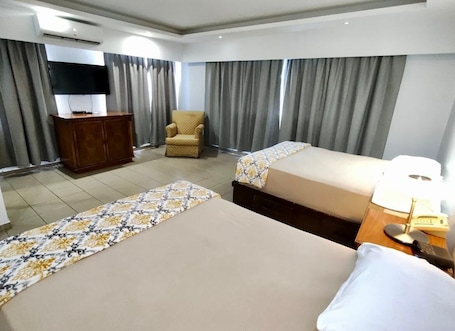 Standard Room, 2 Queen Beds | Pillowtop beds, in-room safe, desk, free WiFi. Micro Hotel Condo Suites
