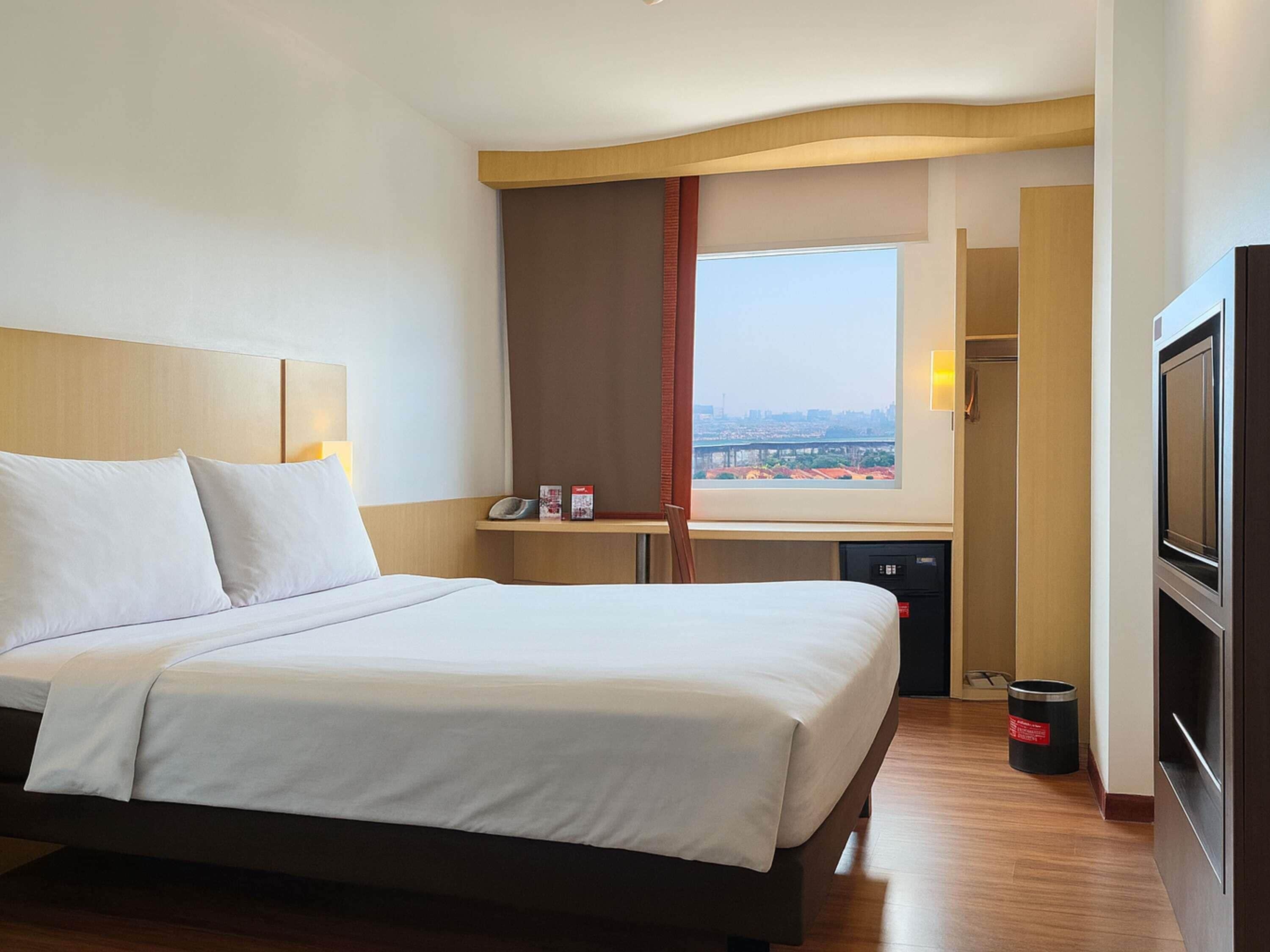 Luxe beddengoed, pillowtop-bedden, een kluis op de kamer, een bureau