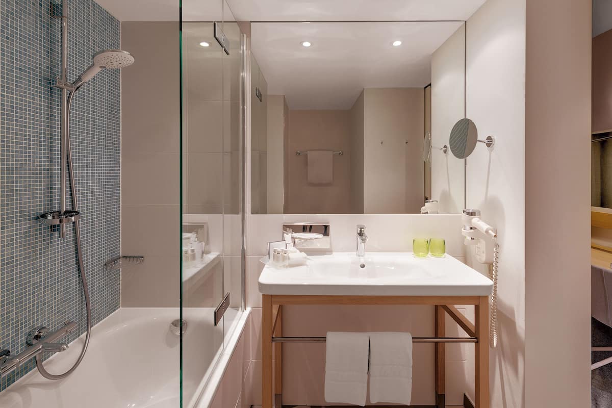 eco-friendly toiletries, hair dryer, towels