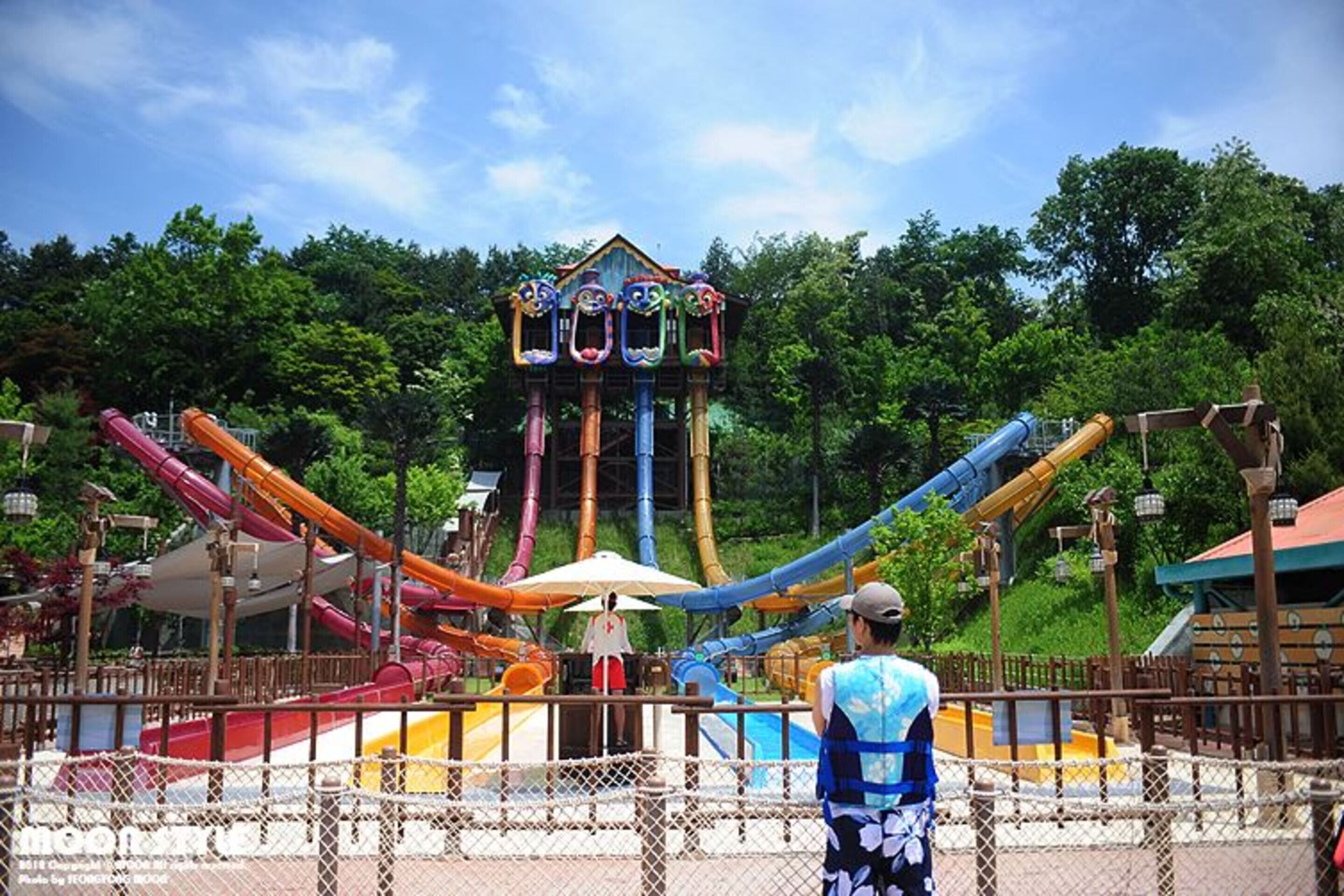 A water park with a central tower and multiple slides.
