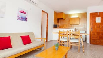 Apartment, 2 Bedrooms, Balcony, City View | Living room | 30-cm flat-screen TV with cable channels, TV