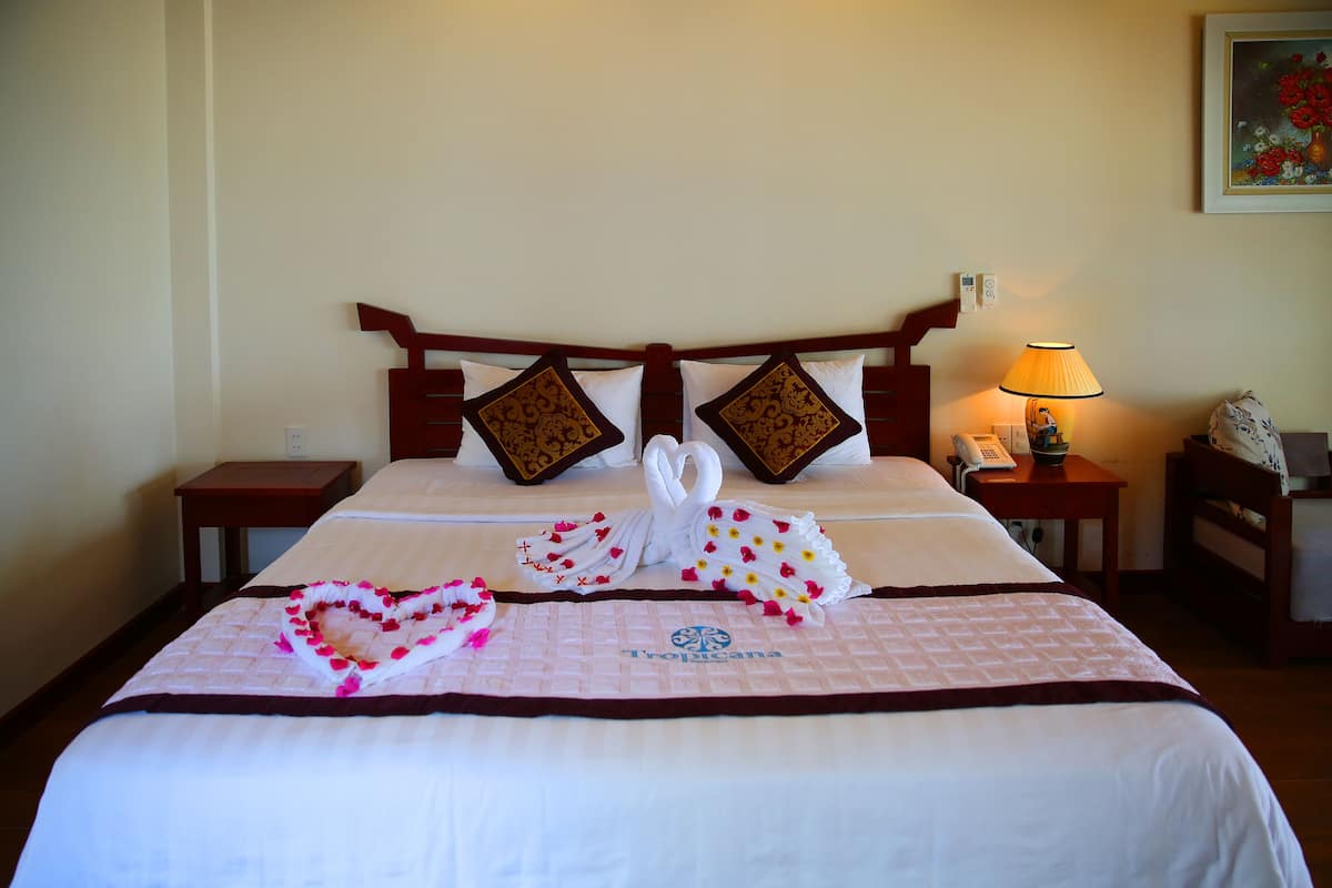 Deluxe Triple Room, Garden View | Living area | LCD TV