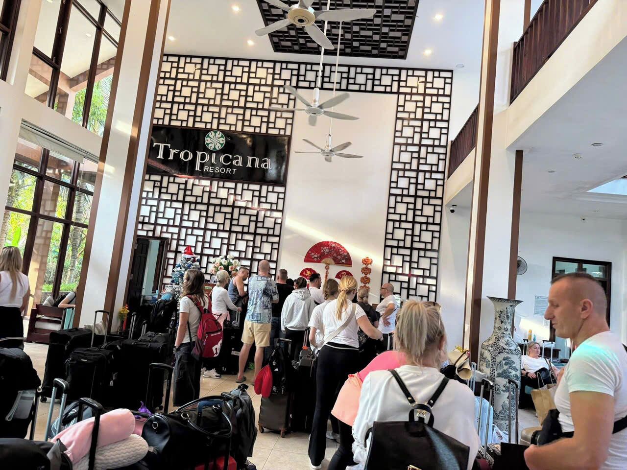 A Tropicana Resort lobby with a modern design, including a patterned wall and ceiling fans.