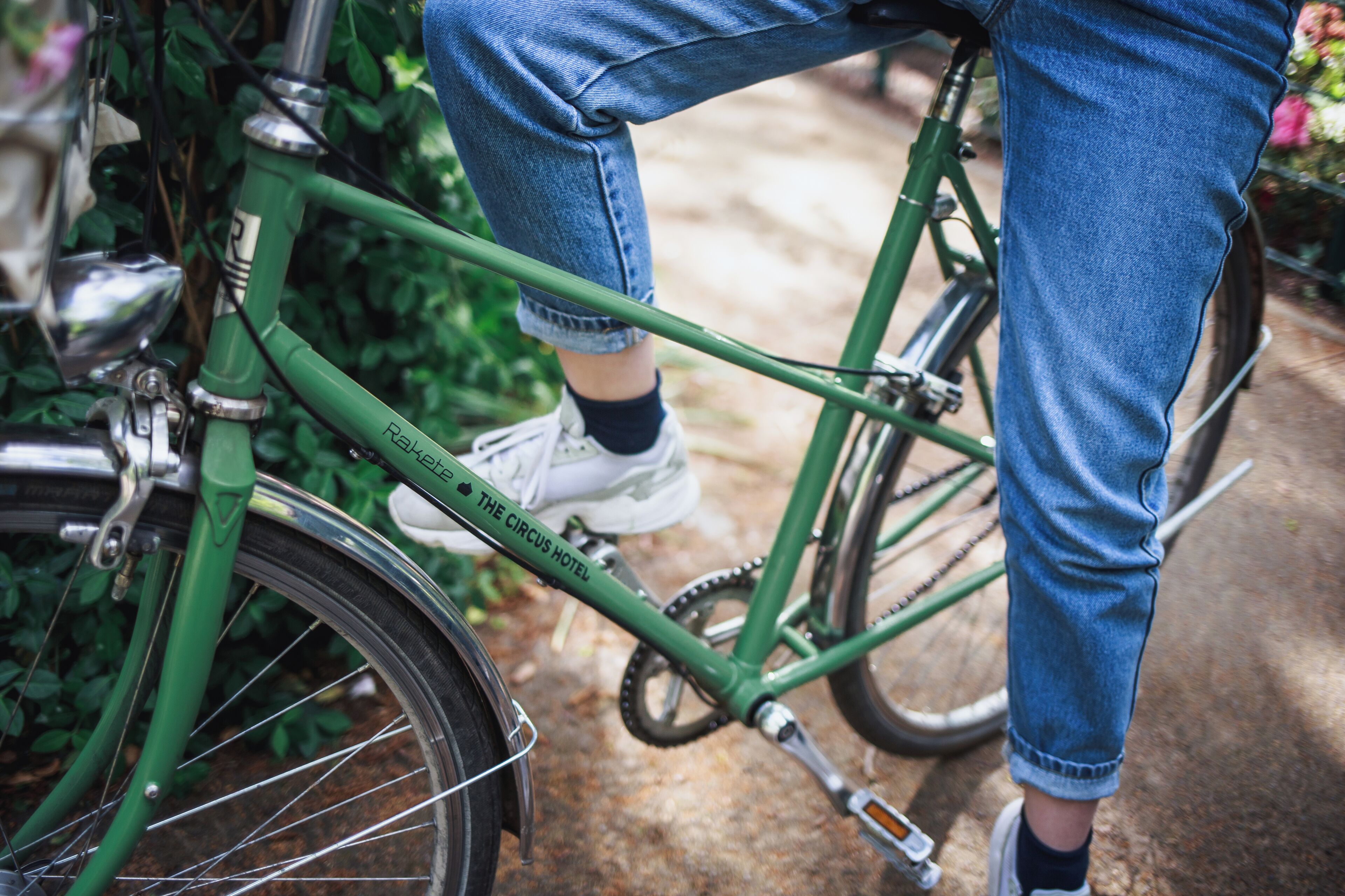 A green bicycle with the inscription "The Circus Hotel" on the frame.