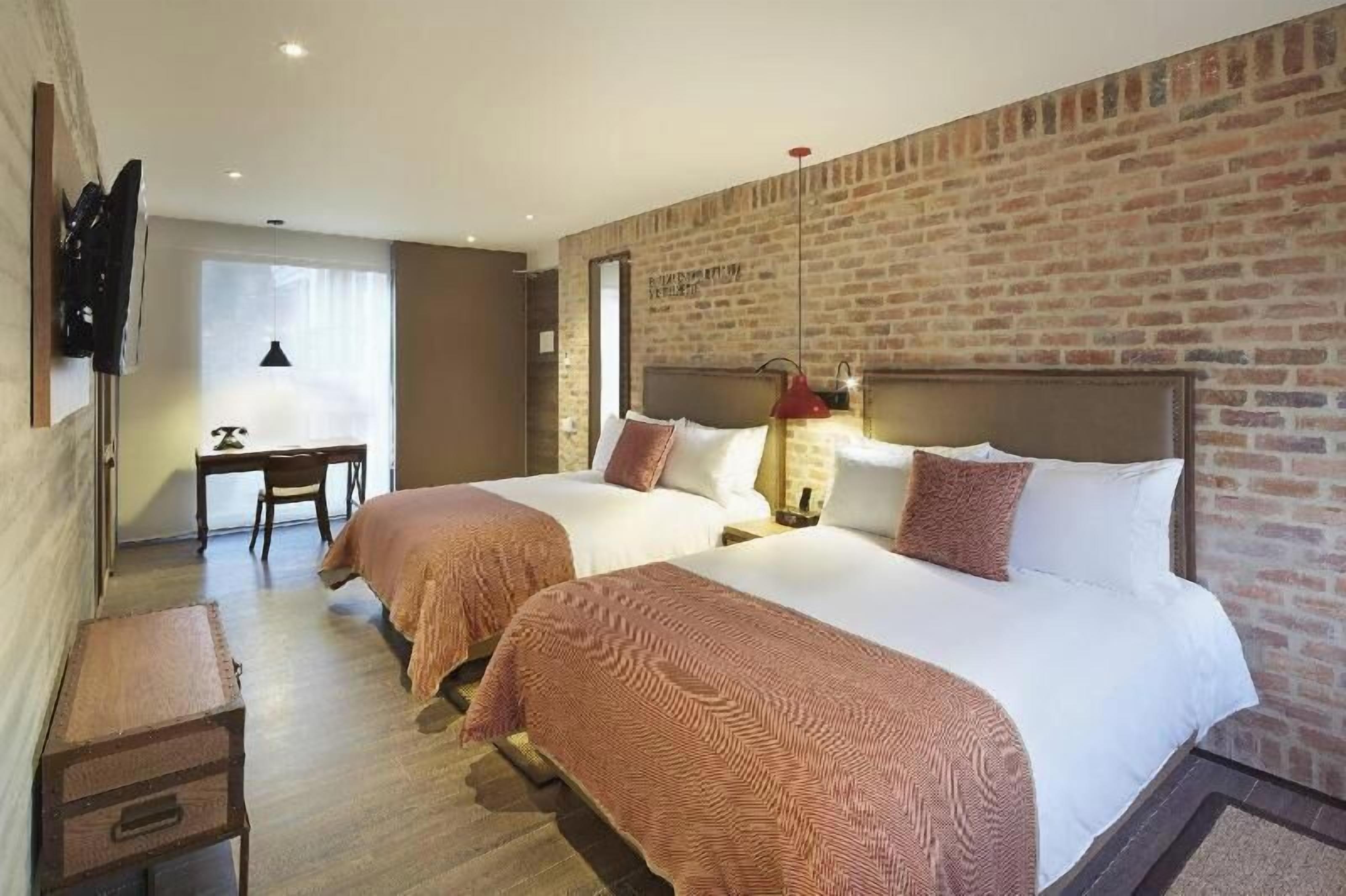 Biancheria da letto di alta qualità, materassi a doppio strato, minibar