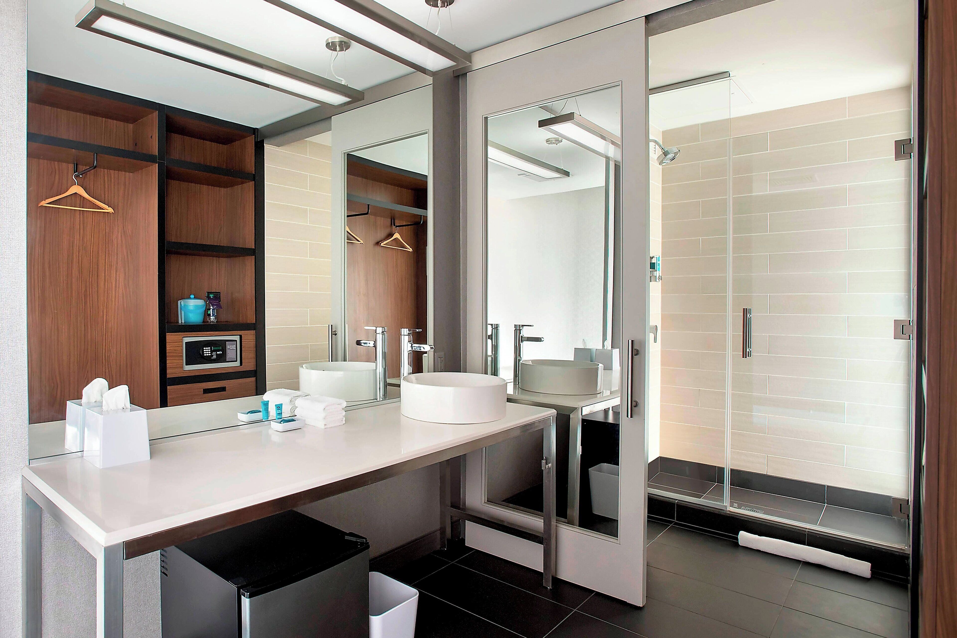 rainfall showerhead, designer toiletries, hair dryer, towels