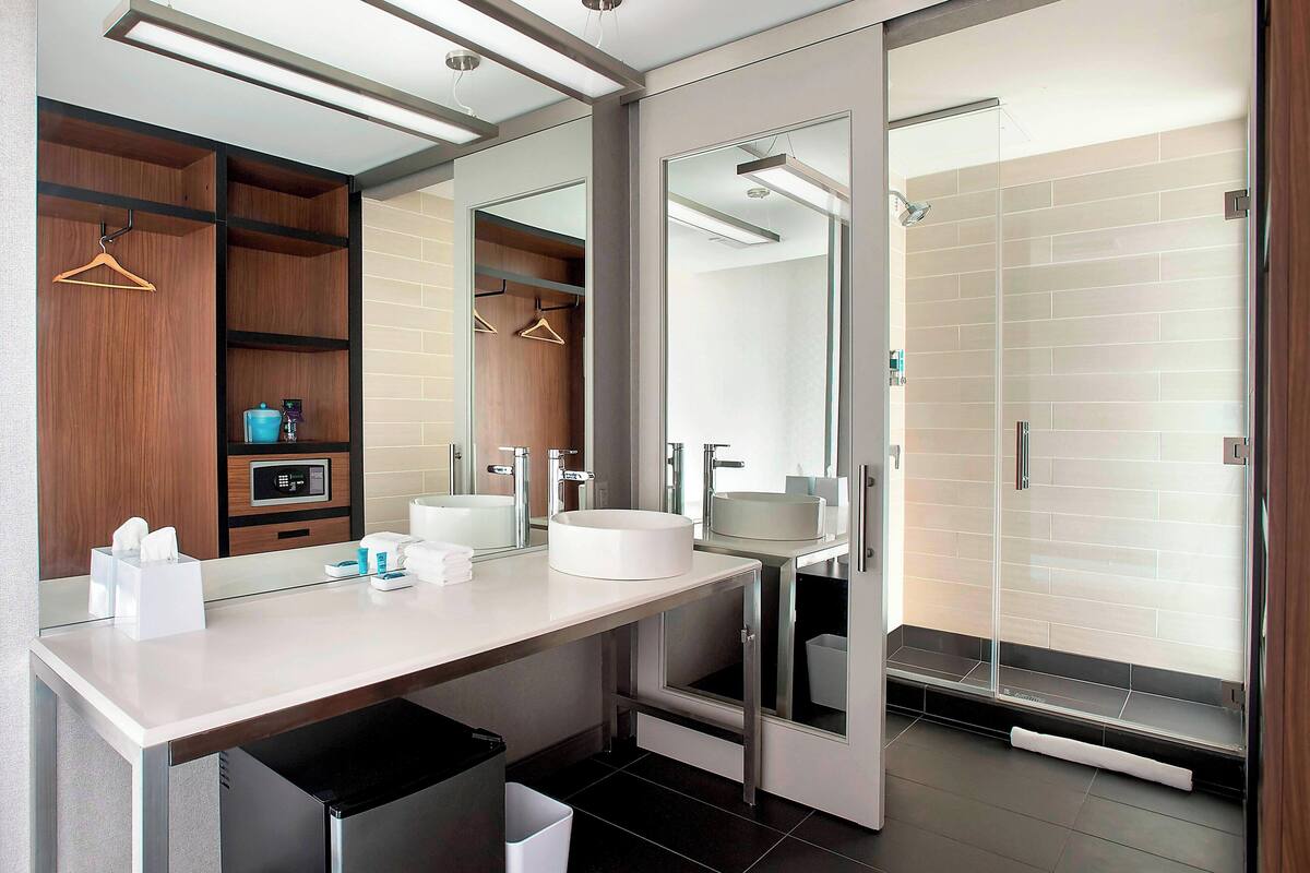 rainfall showerhead, designer toiletries, hair dryer, towels