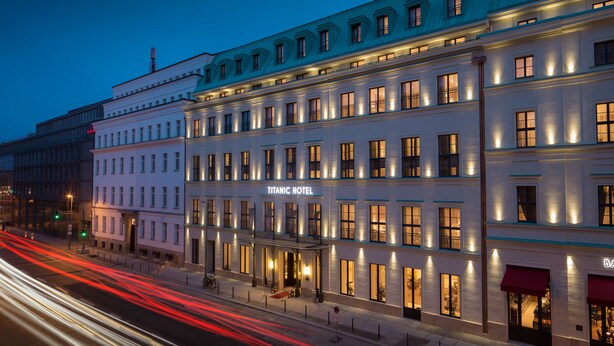 A multi-story building with a prominent sign reading "Titanic Hotel." - TITANIC Gendarmenmarkt Berlin (Berlin)