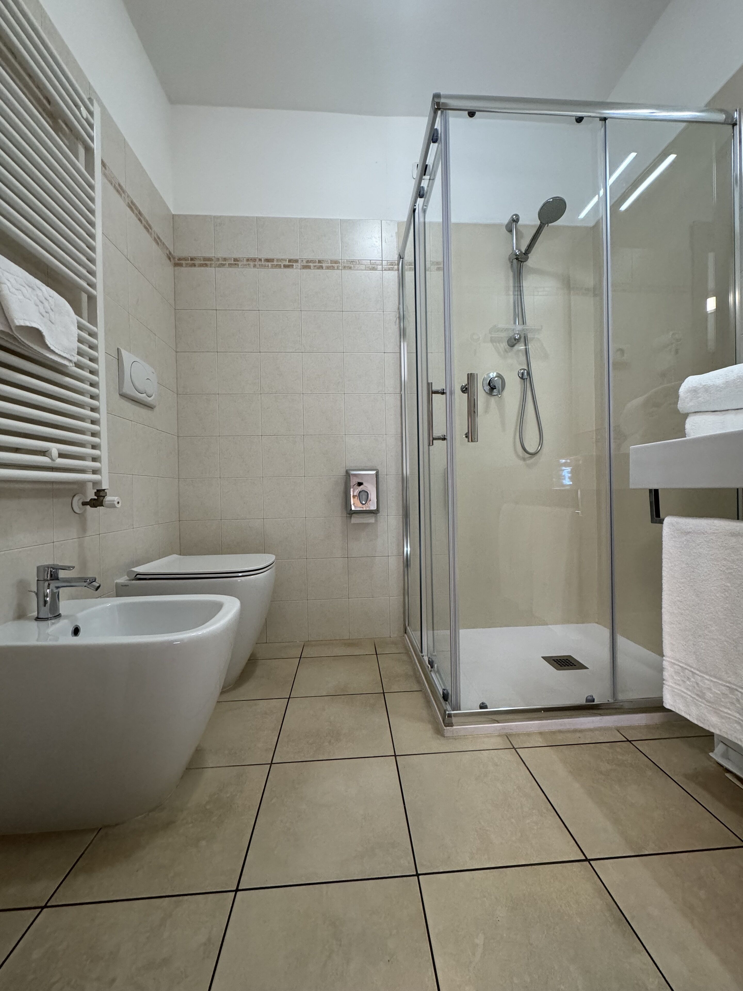 superior double room | bathroom | shower, free toiletries, hair dryer, bathrobes