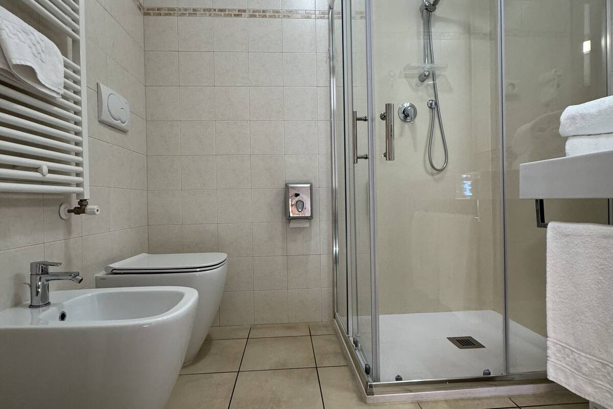 superior double room | bathroom | shower, free toiletries, hair dryer, bathrobes