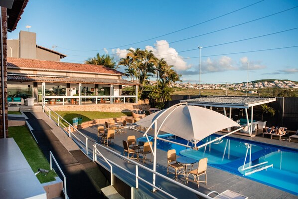 Outdoor pool, pool umbrellas, sun loungers