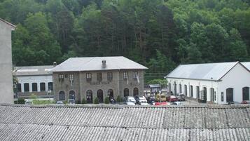 A building with a tiled roof and a sign that reads "RIBES VILA".