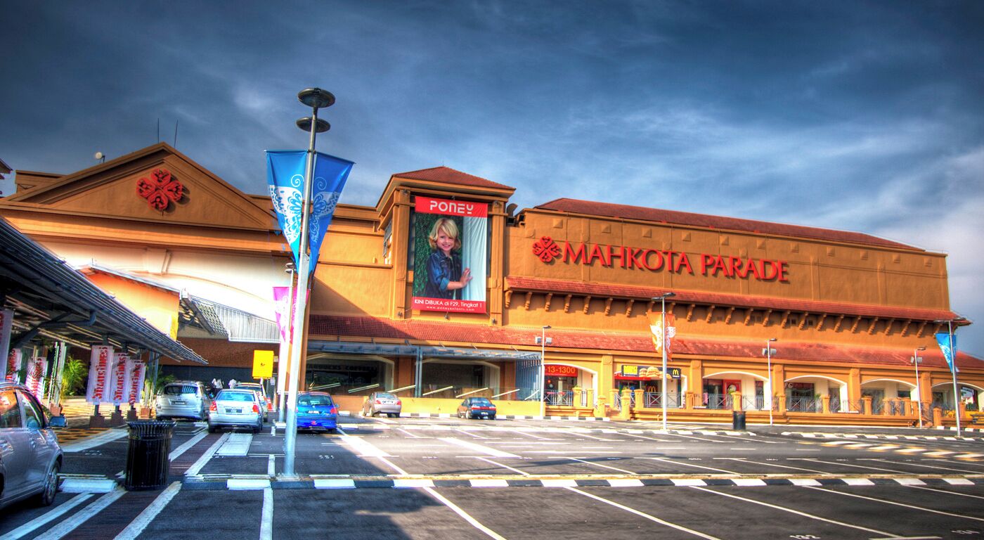 A shopping mall with a large sign for Mahkota Parade.