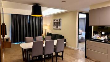Family Suite, 3 Bedrooms | Living area | 40-inch LCD TV with satellite channels, TV