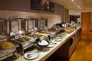 A buffet with various food stations, including a hot pot and a salad bar. - Royal Inn Taipei Nanxi (Taipei)