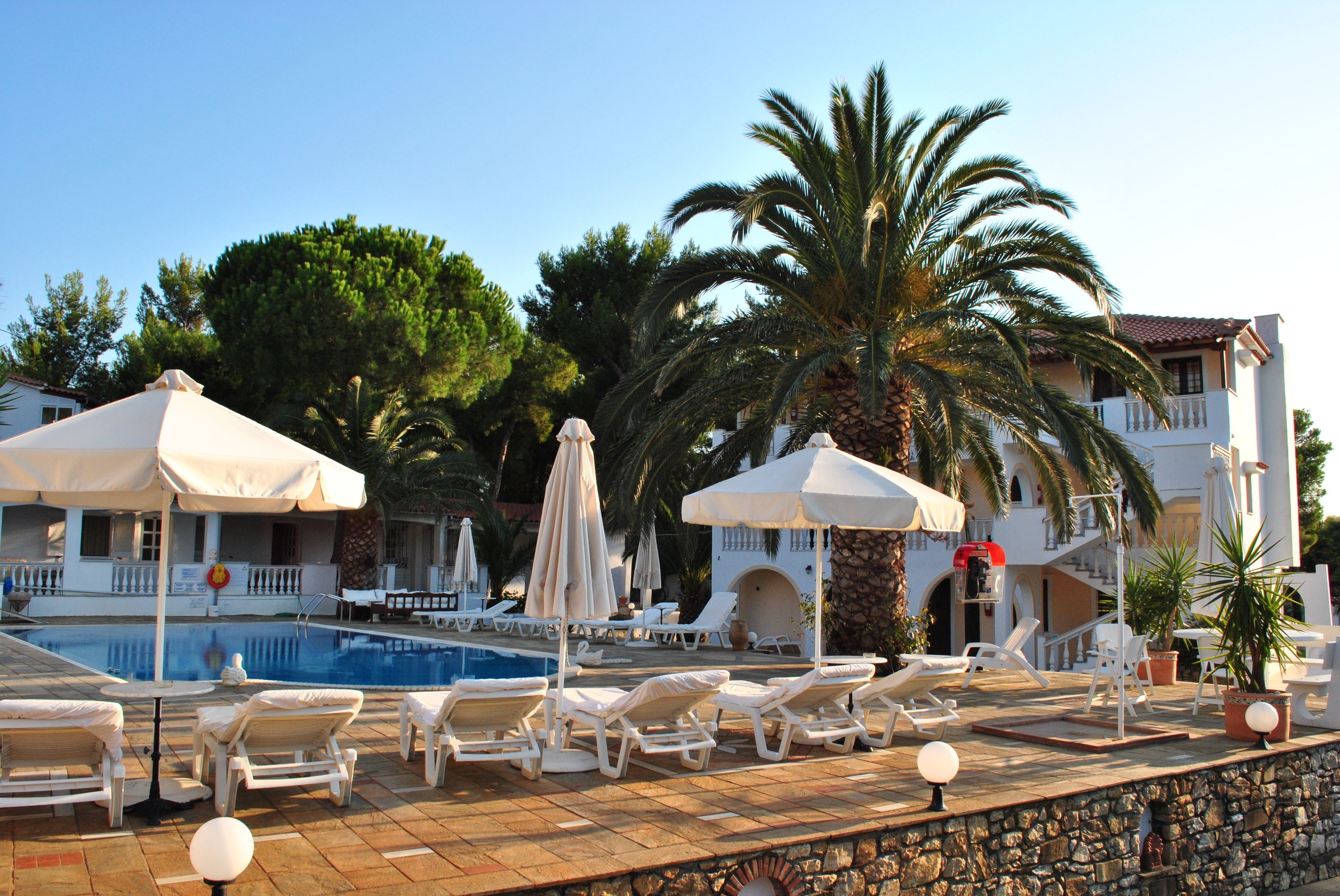 outdoor pool, pool umbrellas, pool loungers