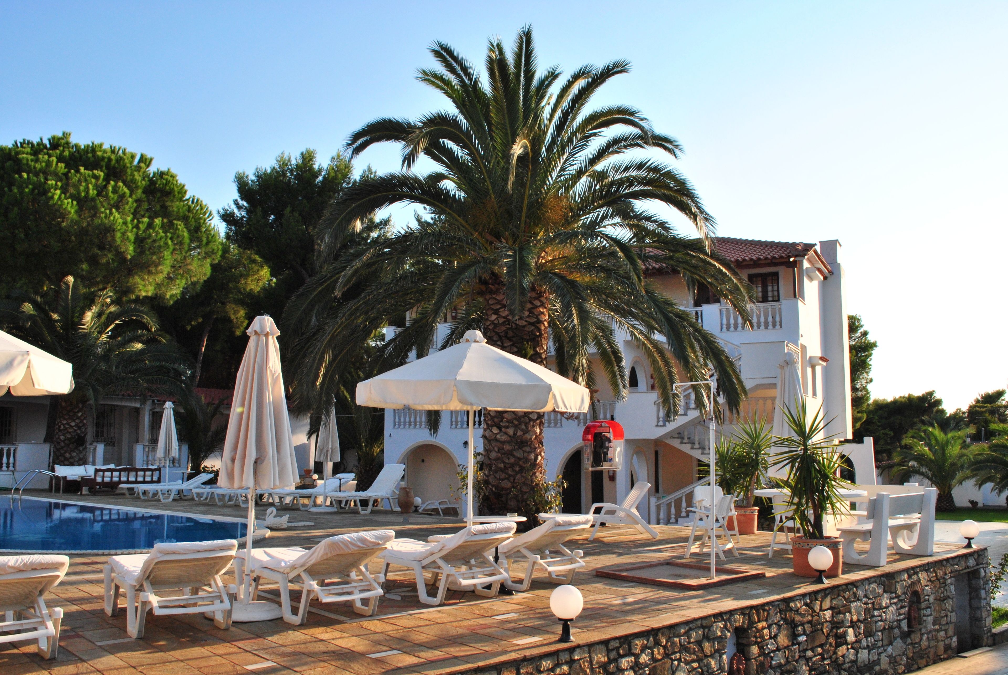 outdoor pool, pool umbrellas, pool loungers