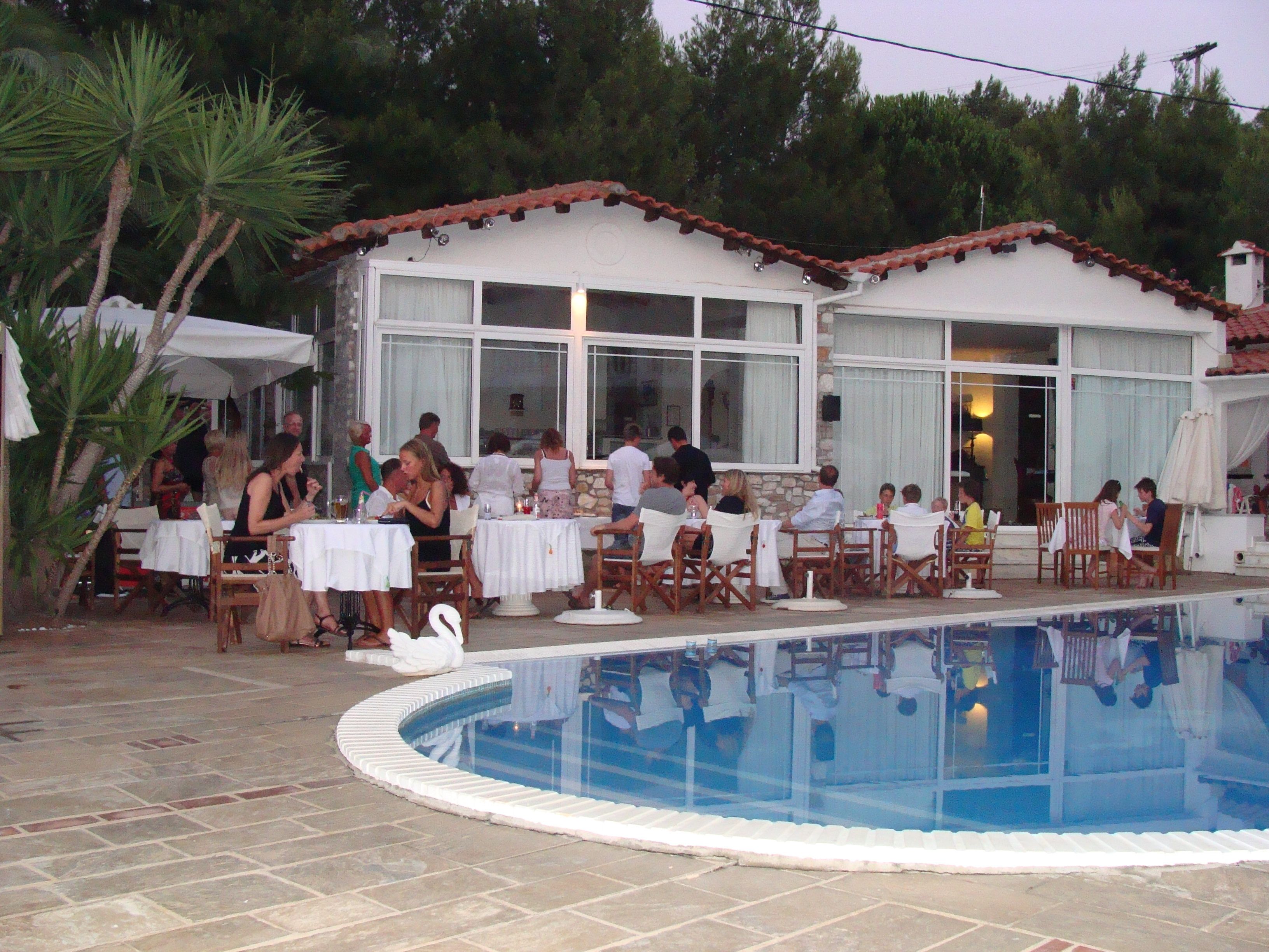 A poolside area with outdoor seating and a swimming pool.