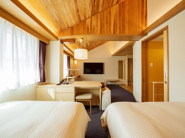 A hotel room with two beds, a desk, a chair, a TV, and a wardrobe. - Kurashiki Ivy Square (Kurashiki)
