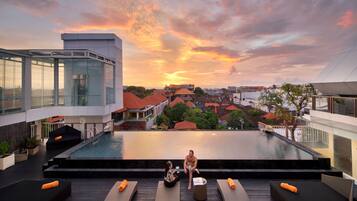 2 outdoor pools, open 7 AM to 8 PM, pool loungers