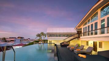 2 outdoor pools, open 7 AM to 8 PM, pool loungers