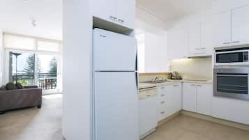 One Bedroom Deluxe Apartment | Private kitchen | Full-sized fridge, microwave, oven, dishwasher