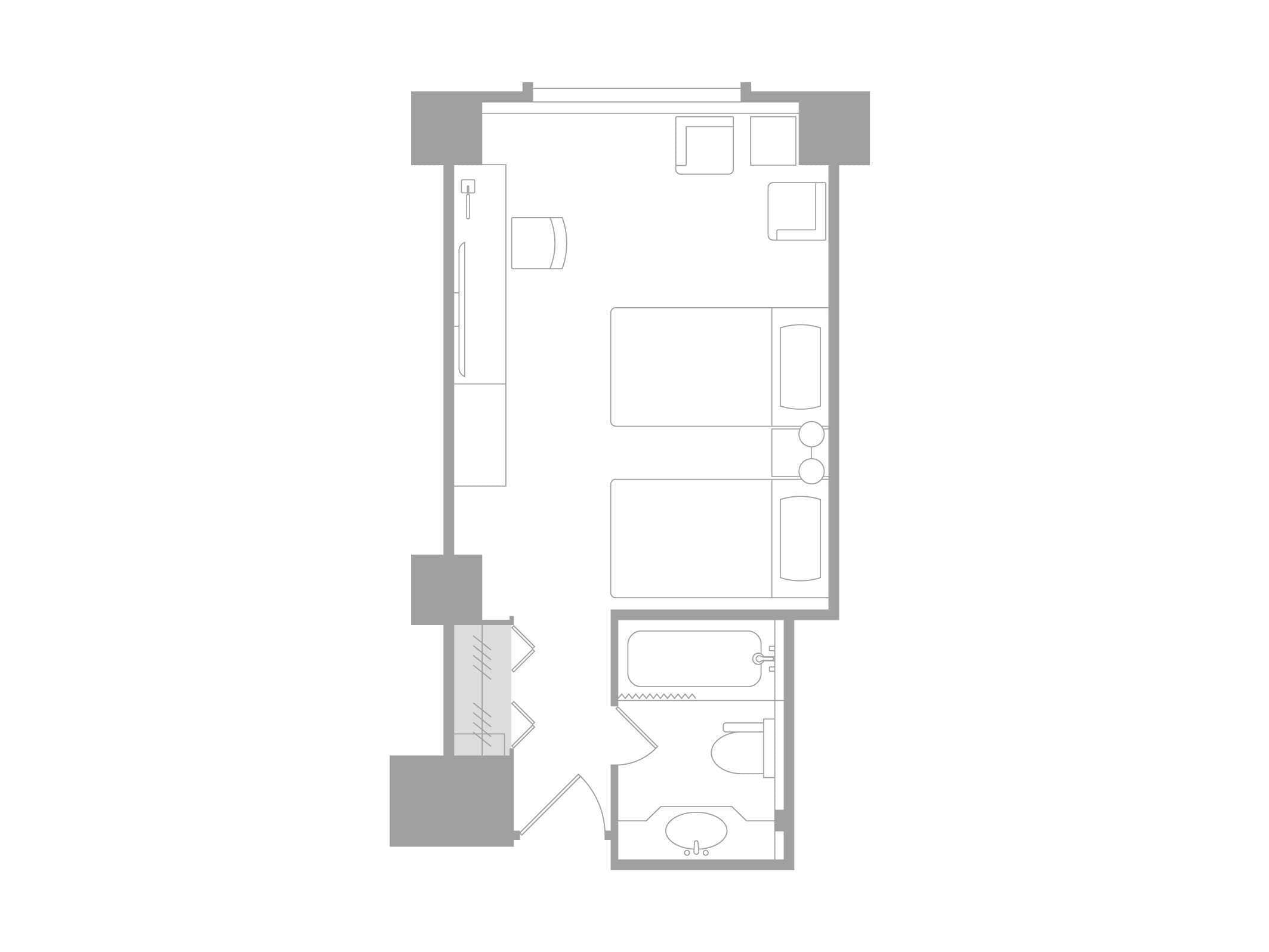 Plano de un cuarto de hotel con baño, kitchenette y zona de estar.