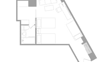 Plano de planta de un hotel con varias habitaciones, una cocina y un baño.