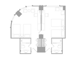 A floor plan of a hotel with two bedrooms, a bathroom, a kitchen, and a living area.