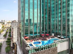 Outdoor pool, open 6:00 AM to 10:00 PM, pool umbrellas, sun loungers