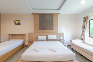 A hotel room with a large bed, a smaller bed, a sofa, and a painting on the wall. - Mai Morn Resort (Wichit)